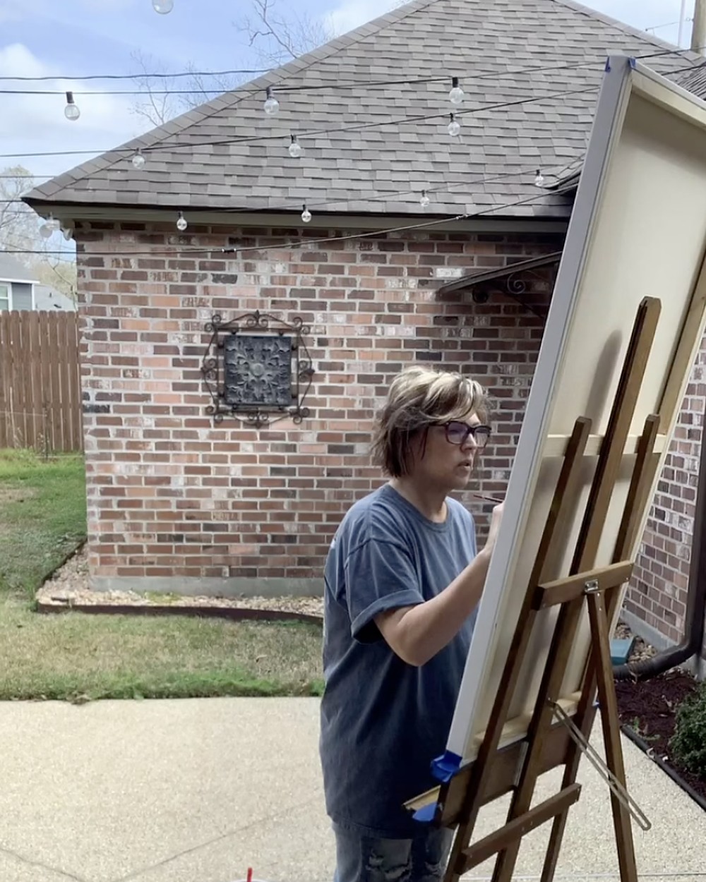 Ash Langford painting in her Baton Rouge studio